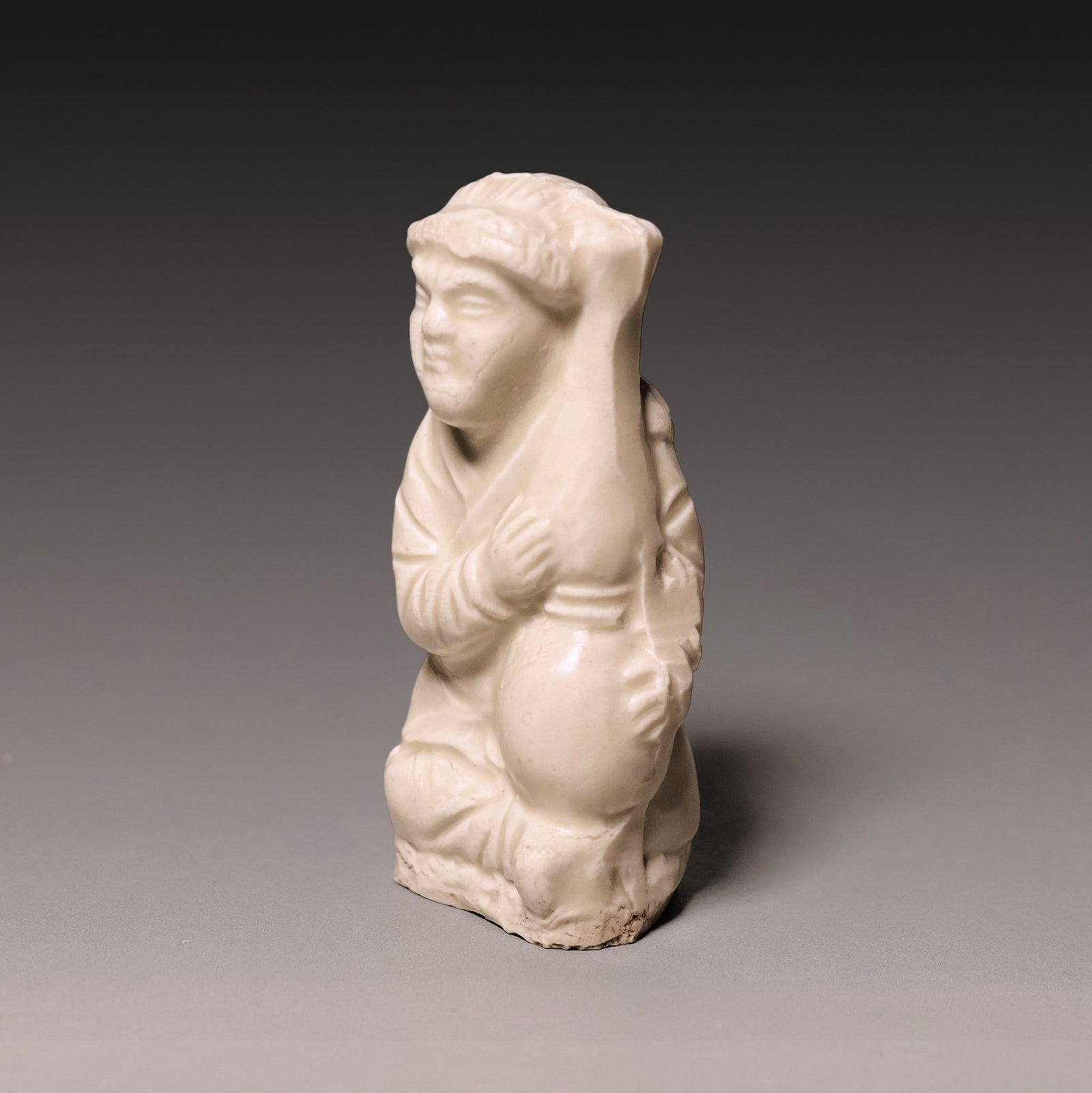 Song Dynasty, White Celadon Glazed Seated Figure - c. 900s to 1200s CE - Imperial China
