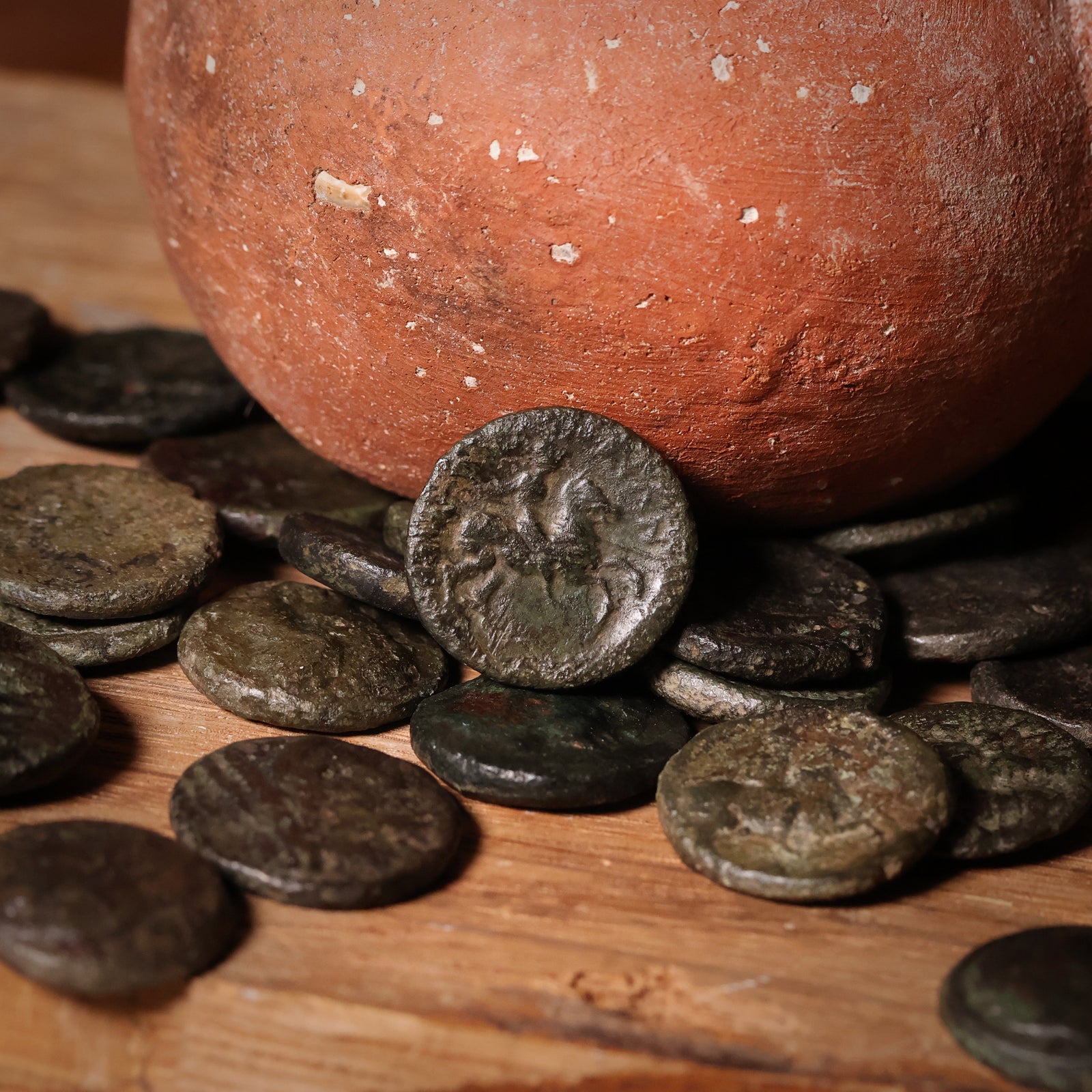 Ancient coin from Thessaly, Greece, displayed in a case with descriptive label.