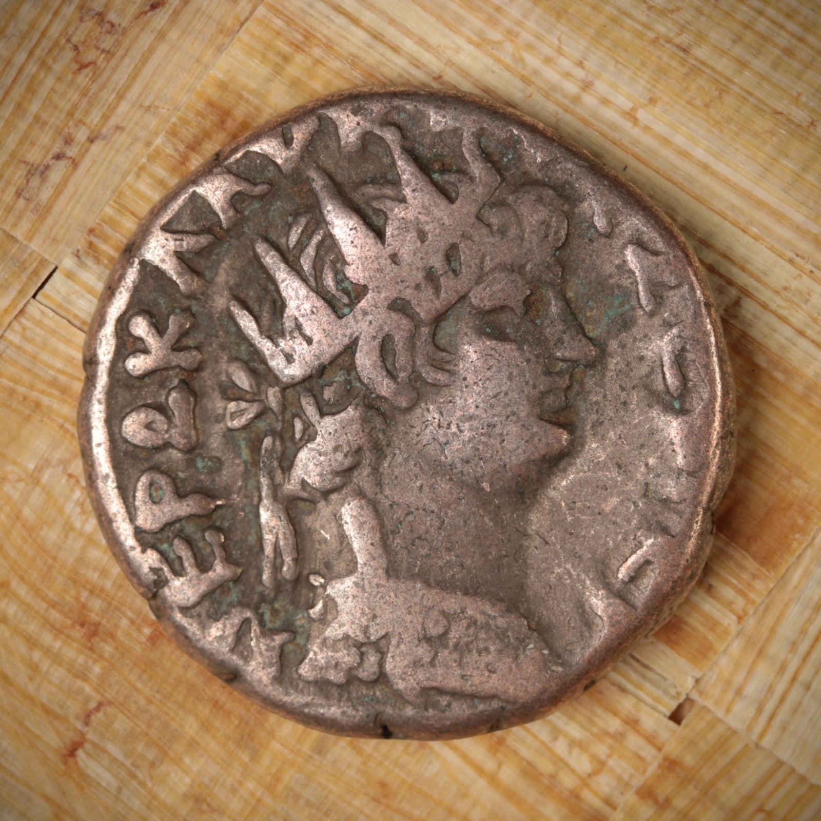 An ancient coin from the Roman Empire, Nero Tetradrachm, displayed in a case with a description label.